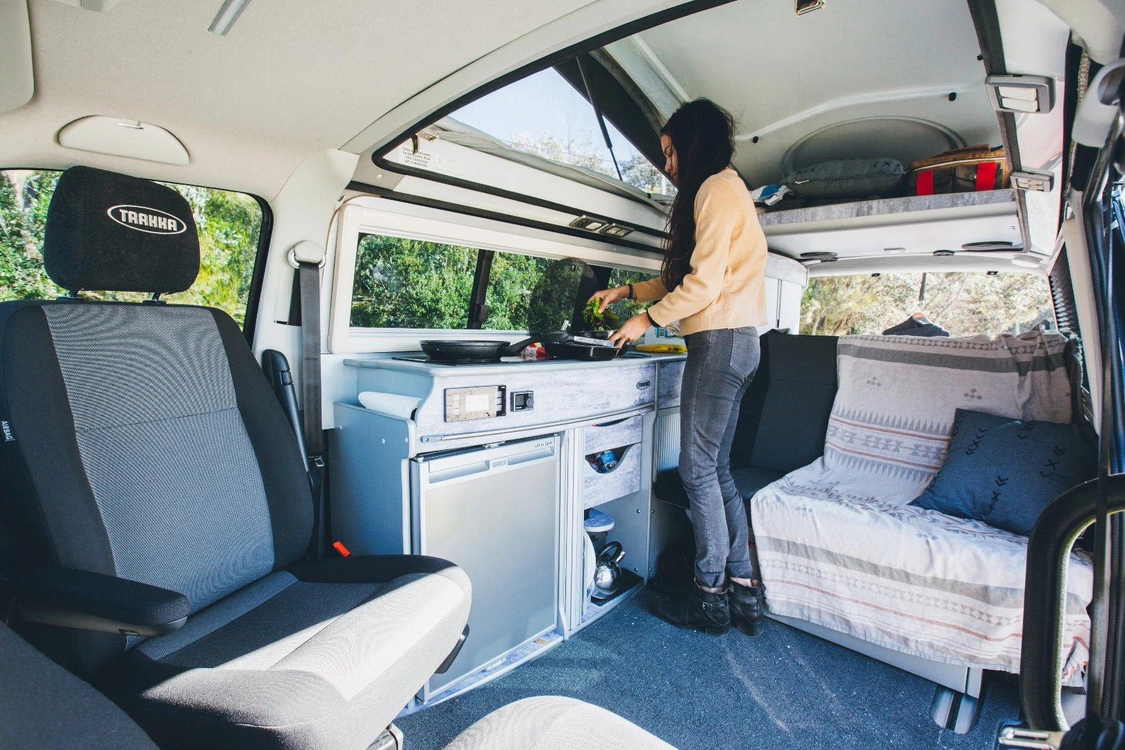 The kitchen area includes a diesel cooktop, fridge/freezer and sink