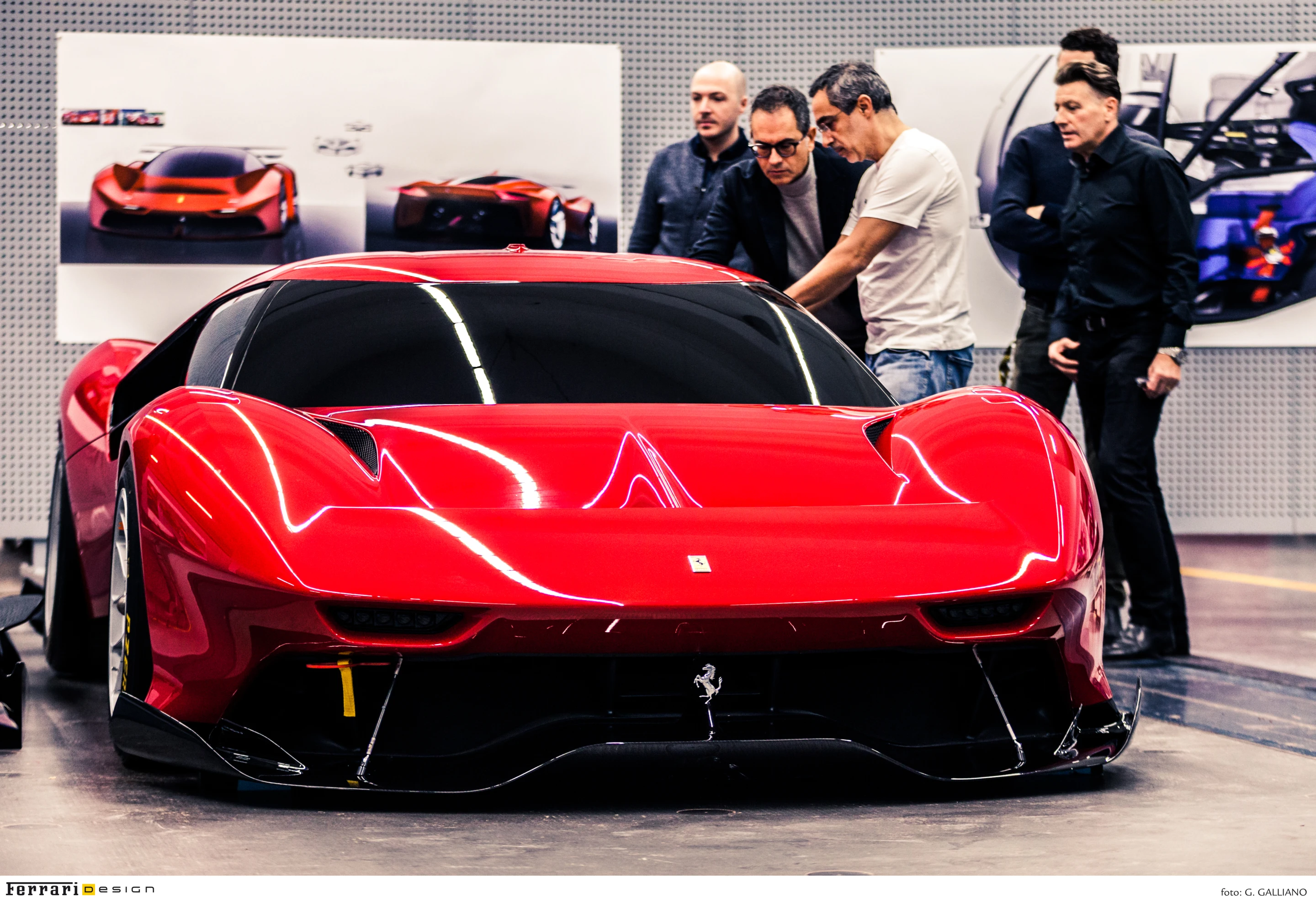 The Ferrari team pores over the P80/C