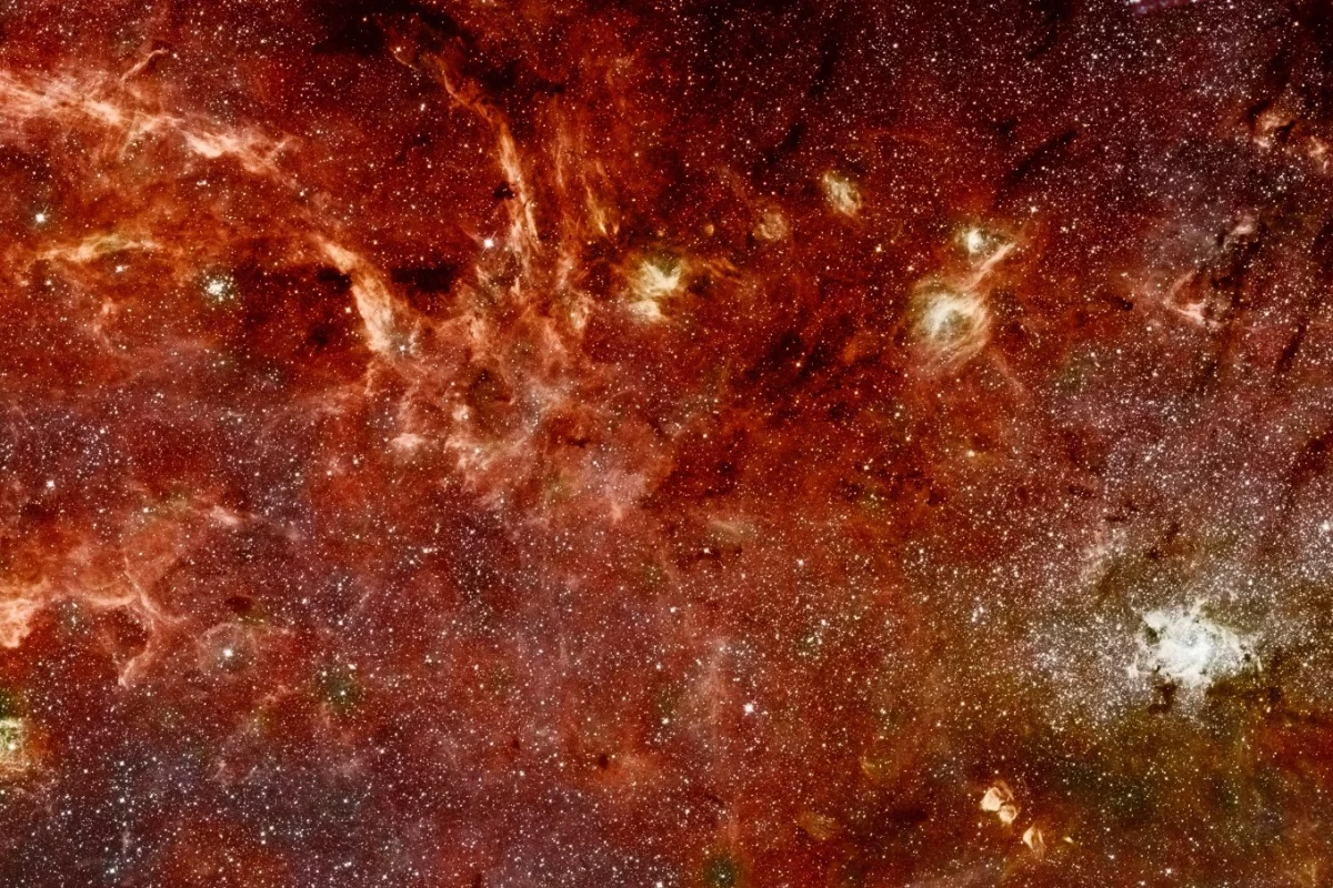 A composite color infrared image of the center of the Milky Way galaxy, where astronomers have now found strange "dusty stellar" objects called G-objects