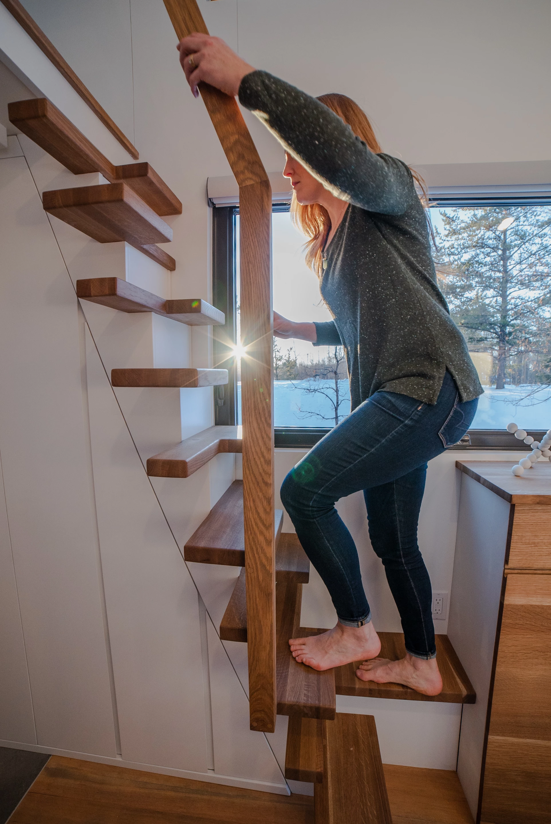 An abundance of storage is hidden beneath the stunning feature staircase