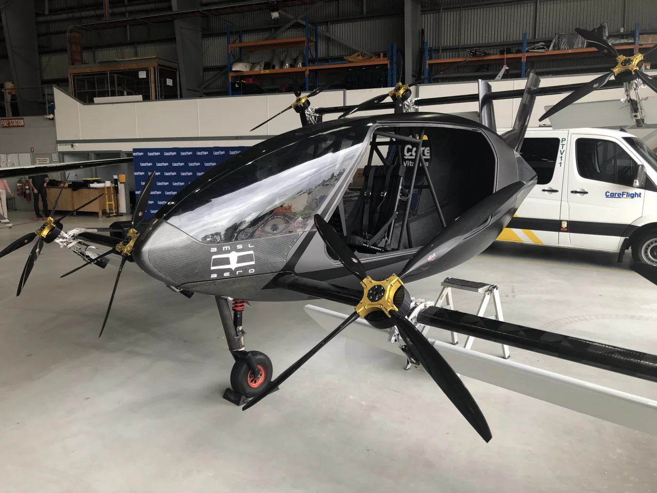 Large electric rotors attached to a carbon fiber pole on tilting mounts