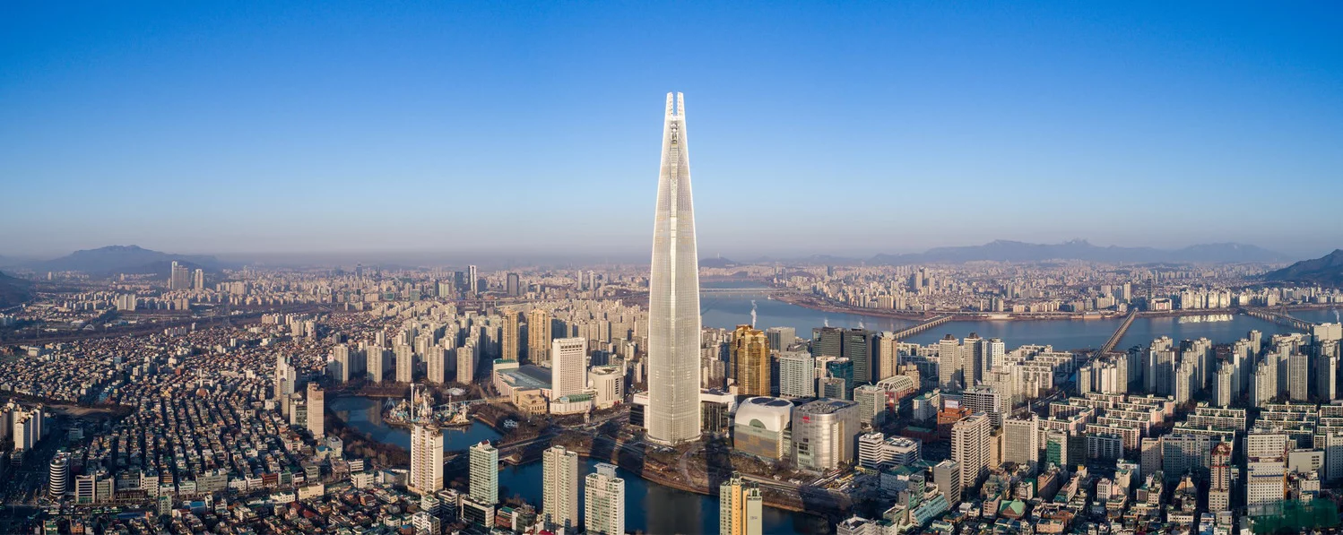 The Lotte World Tower reaches a height of 555 m (1,820 ft)