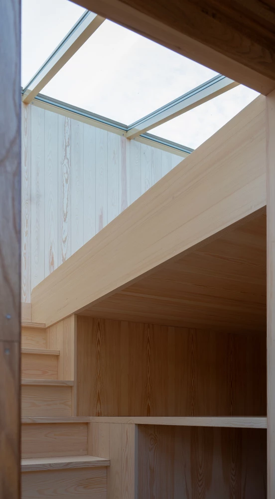 The interior staircase leads to spaces filled with light and peace