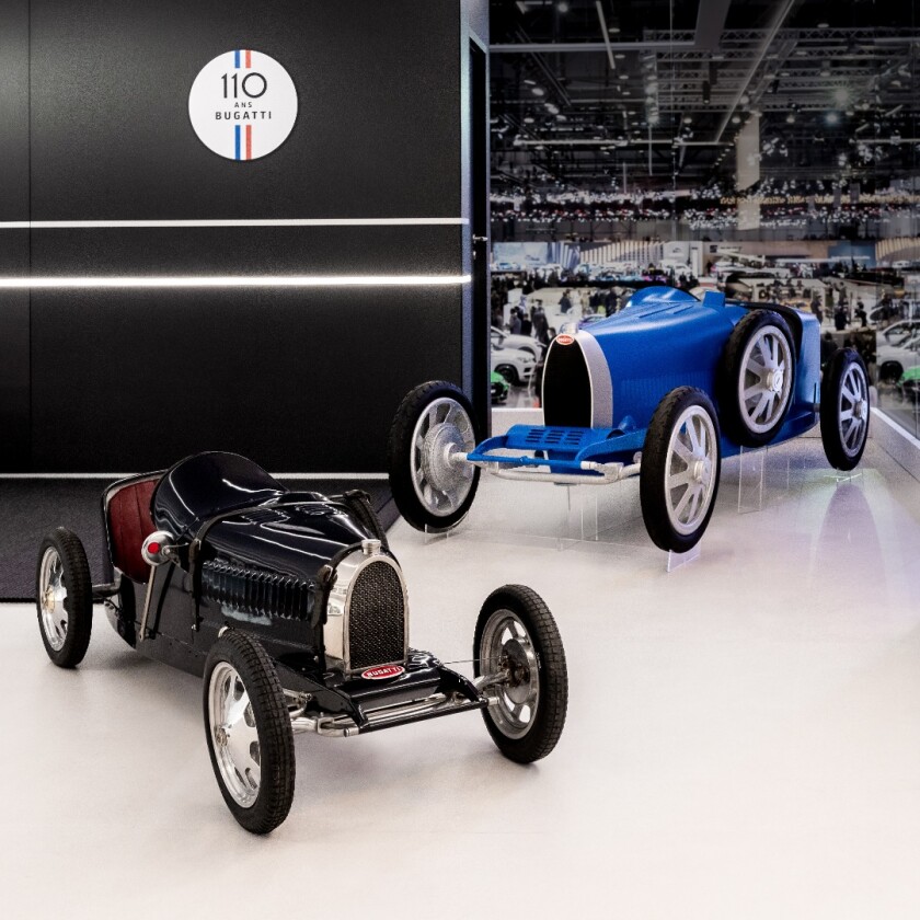 The original Bugatti Baby (foreground) was a child's toy. The new Bugatti Baby II (background) is larger and suitable for both children and adults
