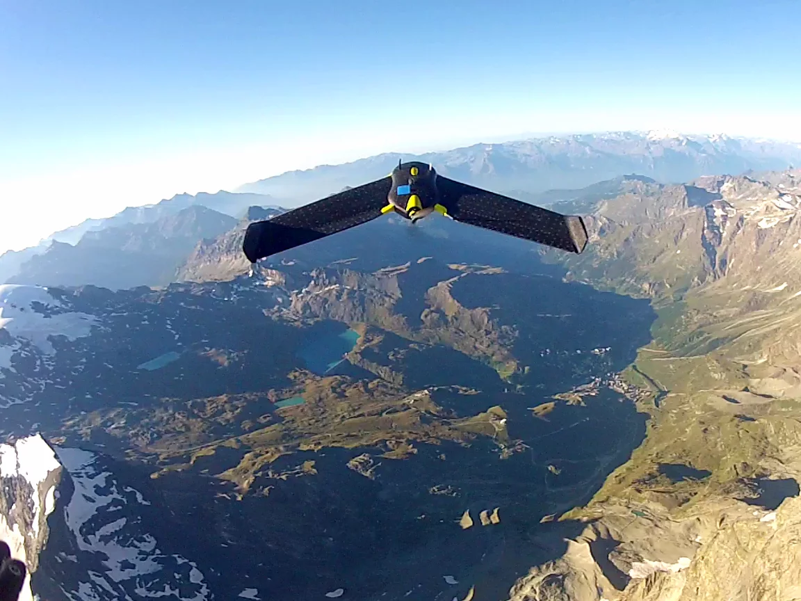 An eBee drone sails over the Matterhorn, acquiring data and taking pictures