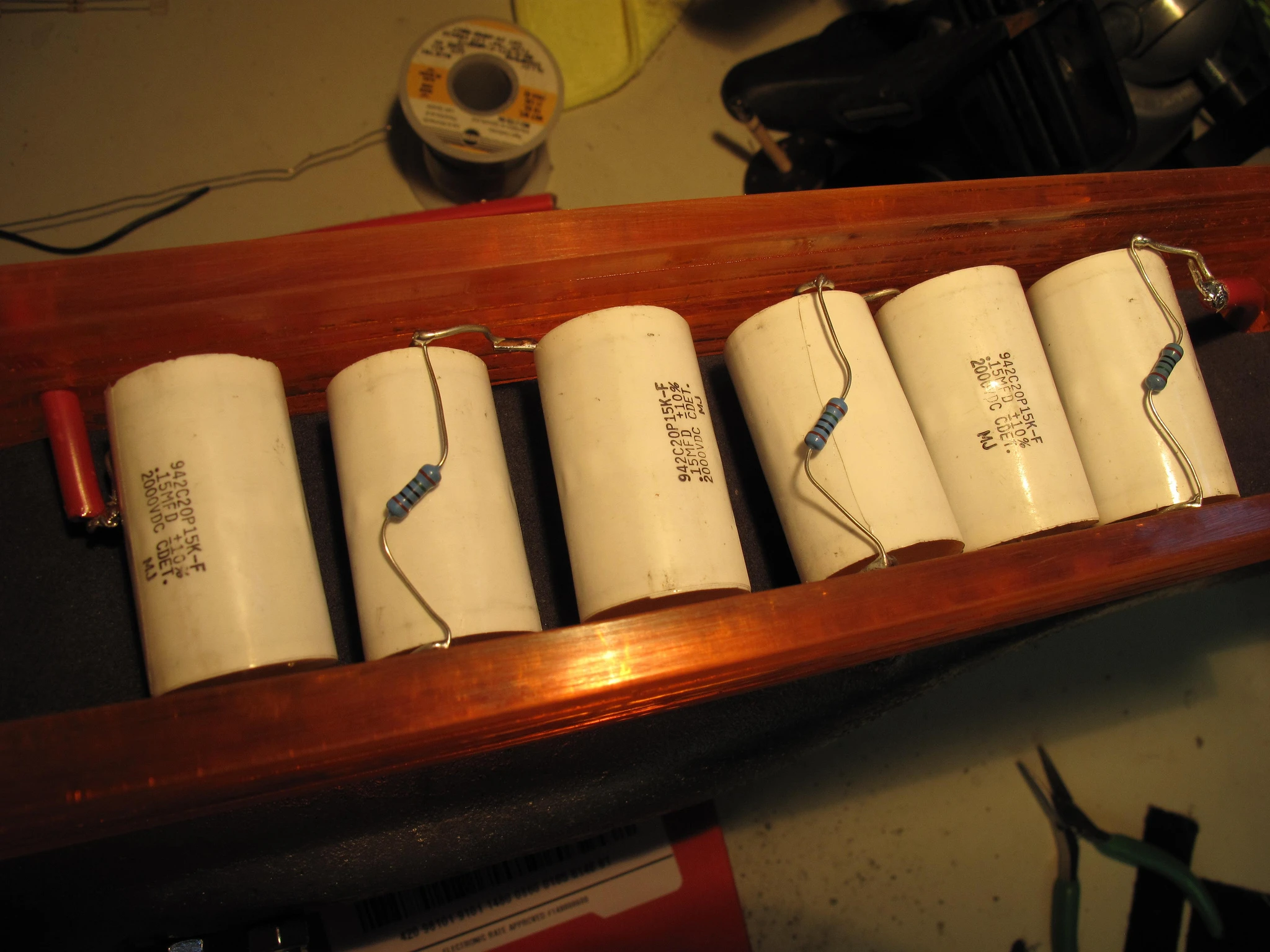 The bank of capacitors in their own custom housing
