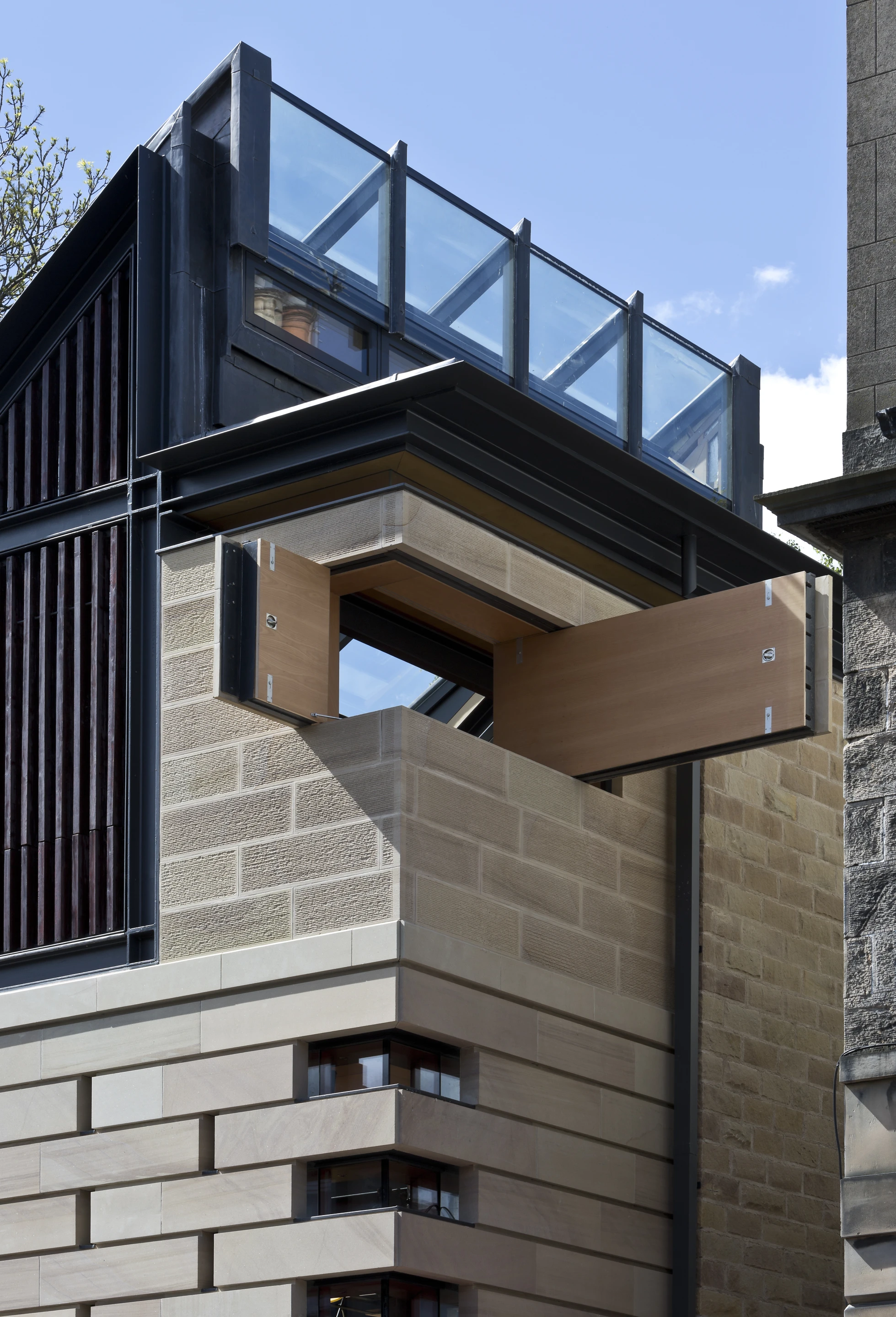 Richard Murphy installed novel design touches like pulleys and levers which move sections of wall to open up the home to the sun