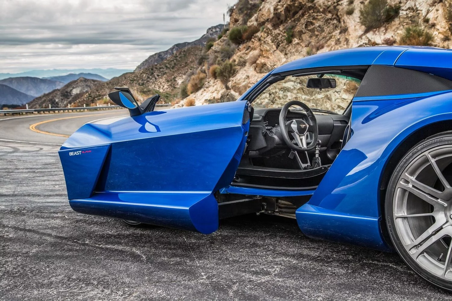 The SideWinder doors on the Rezvani Beast Alpha pop out and then slide forward