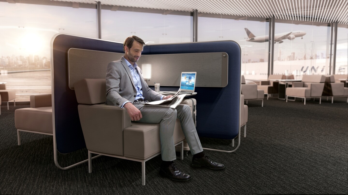 Bespoke lounge seating with high sides provides privacy, as well as storage for coats and bags, pull out tables with integrated tablet holders and charging points