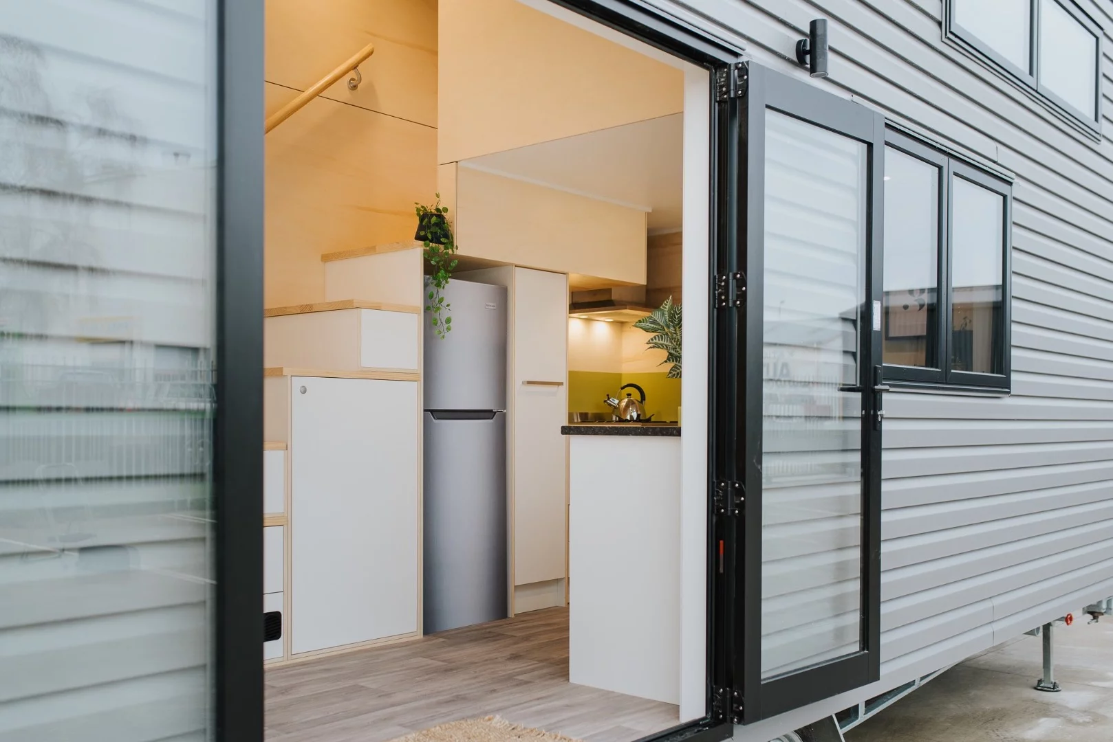 The Green Hill Farm Tiny House is finished in vinyl siding
