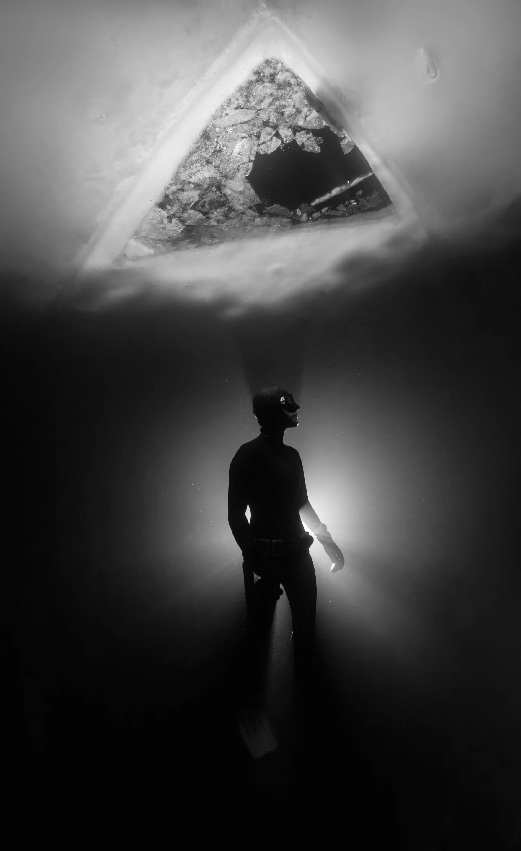 Highly commended, Category - Black & White. A free diver under water the instantly freezes dues to the cold