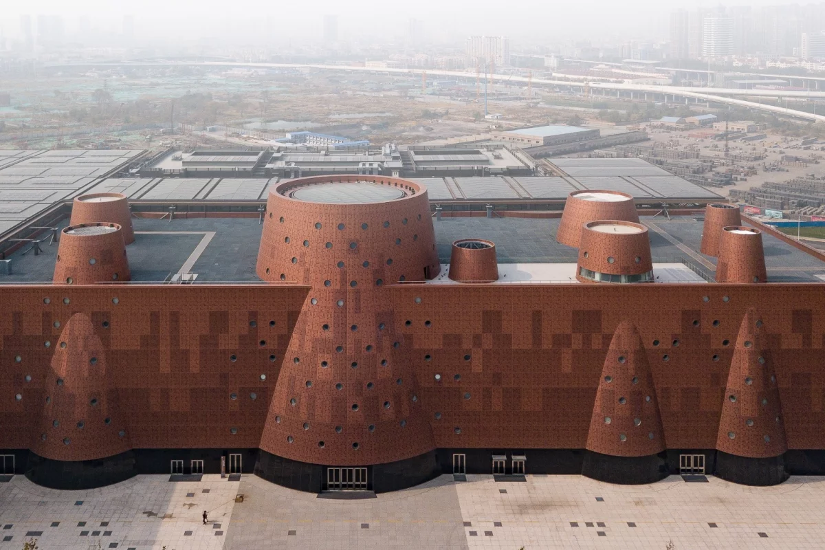 The Exploratorium measures 33,000 sq m (355,200 sq ft) and is finished in an eye-catching reddish aluminum facade