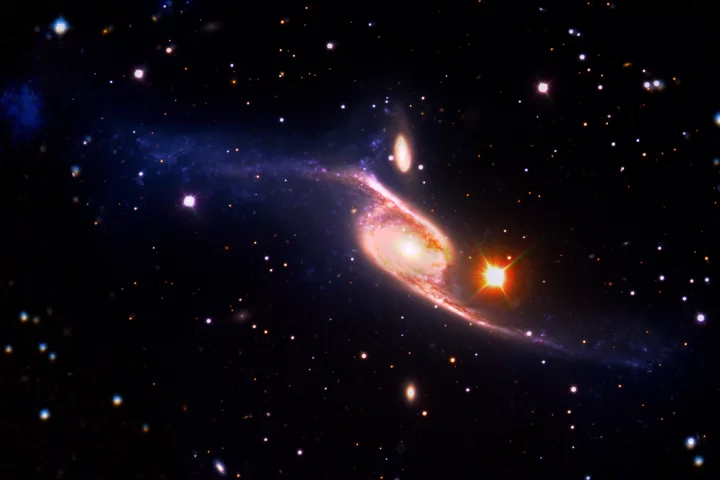 Spiral galaxy NGC 6872 is some five times the size of the Milky Way