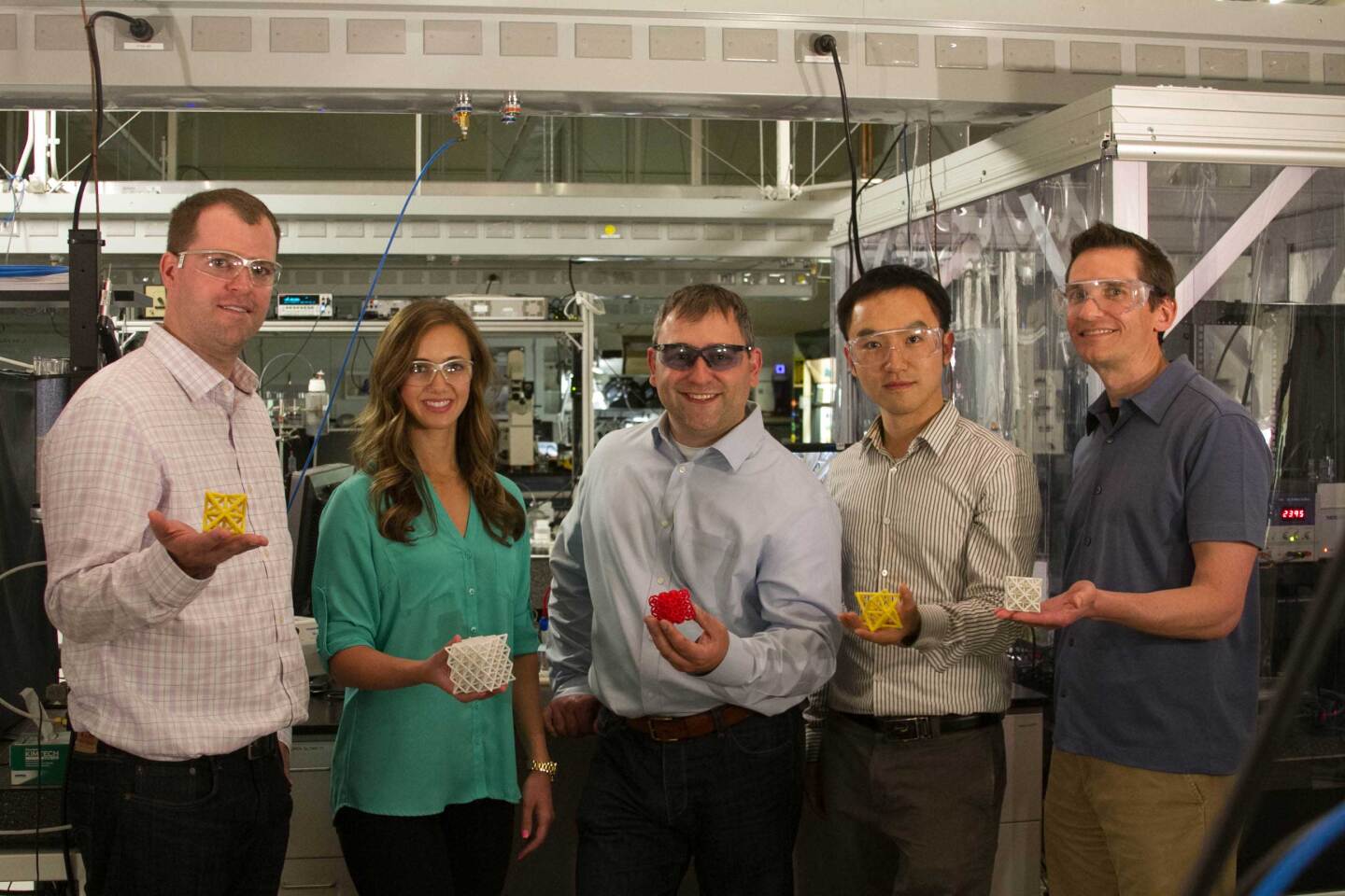 The LLNL research team with examples of microstructure cells (Image: LLNL)
