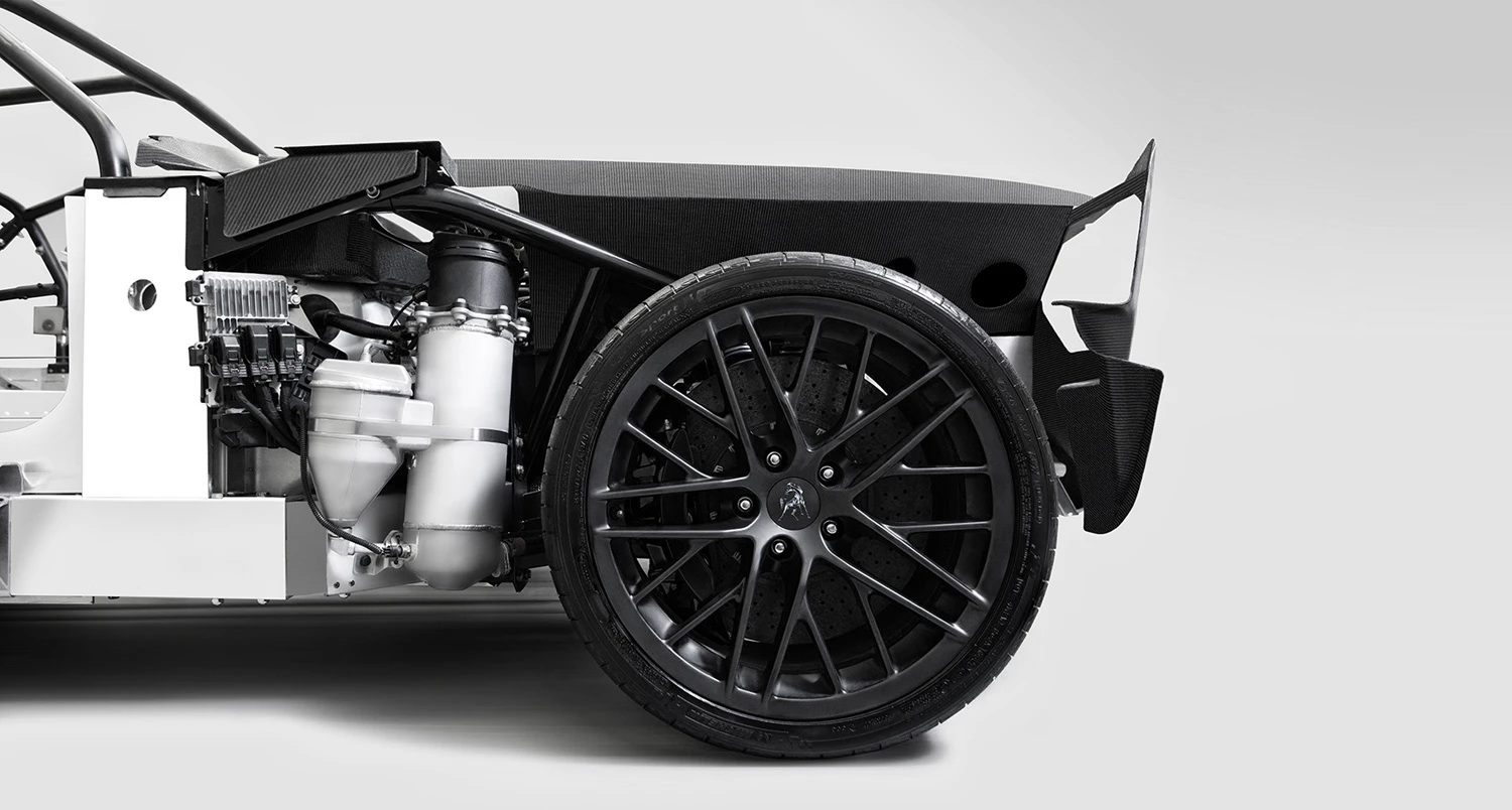 770 uses an aluminum chassis to keep weight down, carbon ceramic brakes and a rear mounted 6-speed transaxle for improved weight distribution