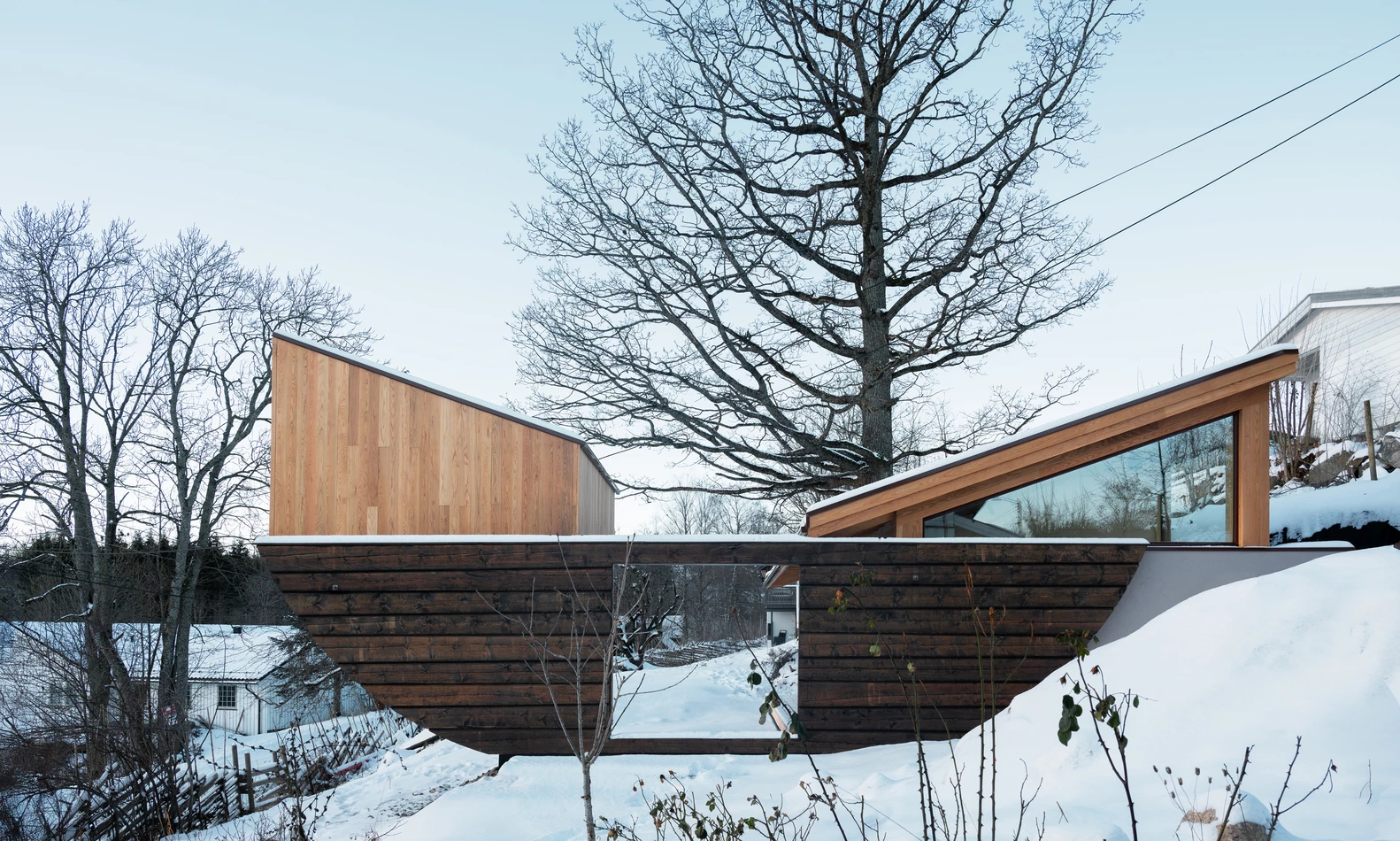 The space feels like a gentle boat, gracefully floating above the landscape