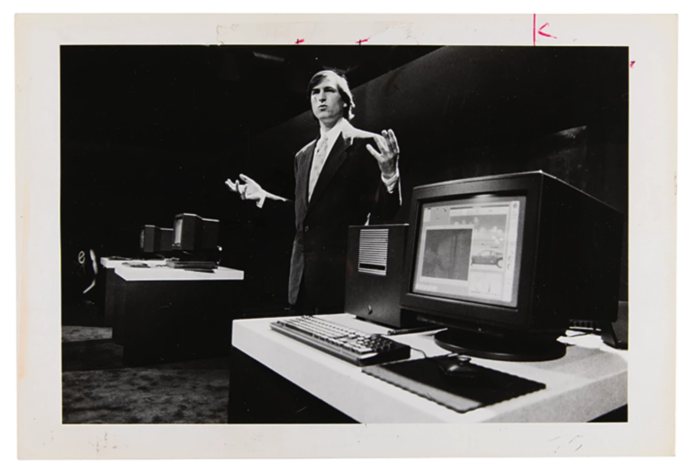 This is not a pic of Steve Jobs showing the iPhone for the first time, but a pic taken much earlier in Jobs career when he was fighting for his business existence as the CEO of NeXt. The pic itself is for sale in this auction as part of the Collection of Clement Mok - and it masterfully captures Jobs' powerful showmanship.
