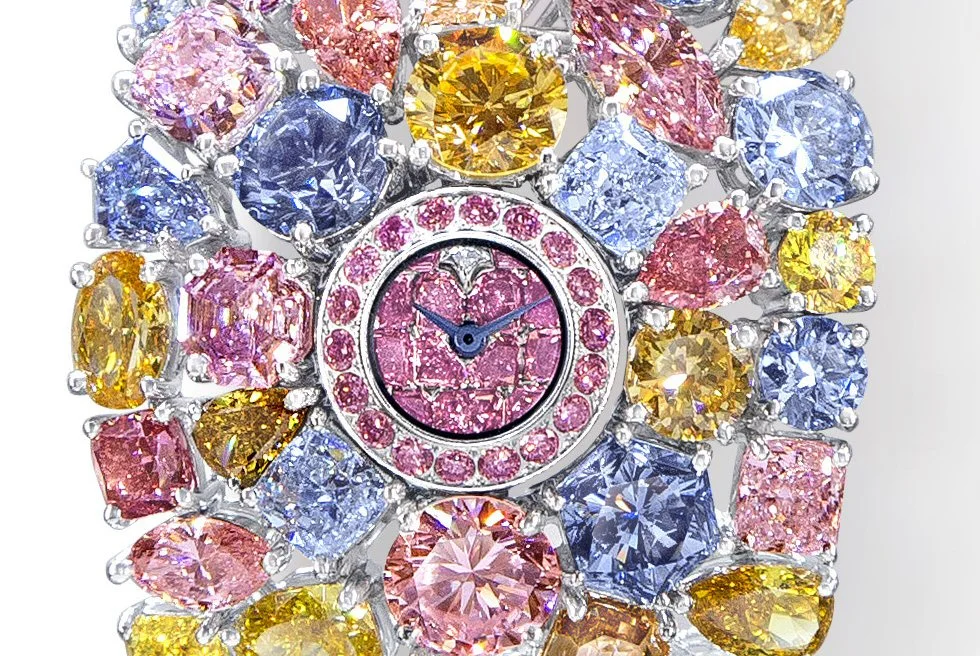 The Hallucination's petite watch face in the center of over 110 carats of rare colored diamonds almost seems like an afterthought