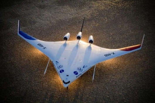 Boeing's Blended-Wing Body (BWB) X-48B prototype at sunset on Rogers Dry Lake, adjascent to NASA DFRC. Photo by Robert Ferguson, Boeing.