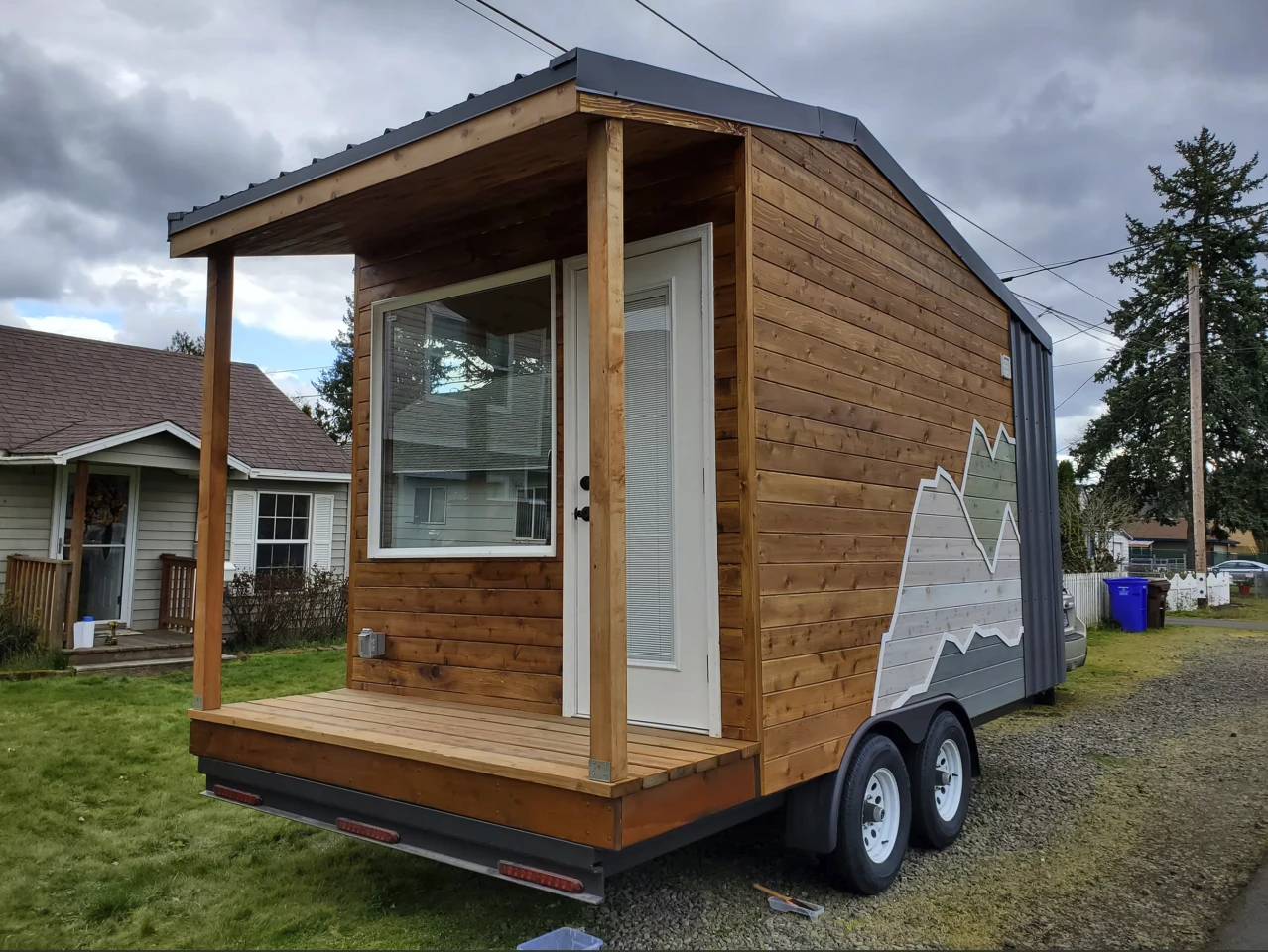 This tiny house shrinks down to chase the road, not the family