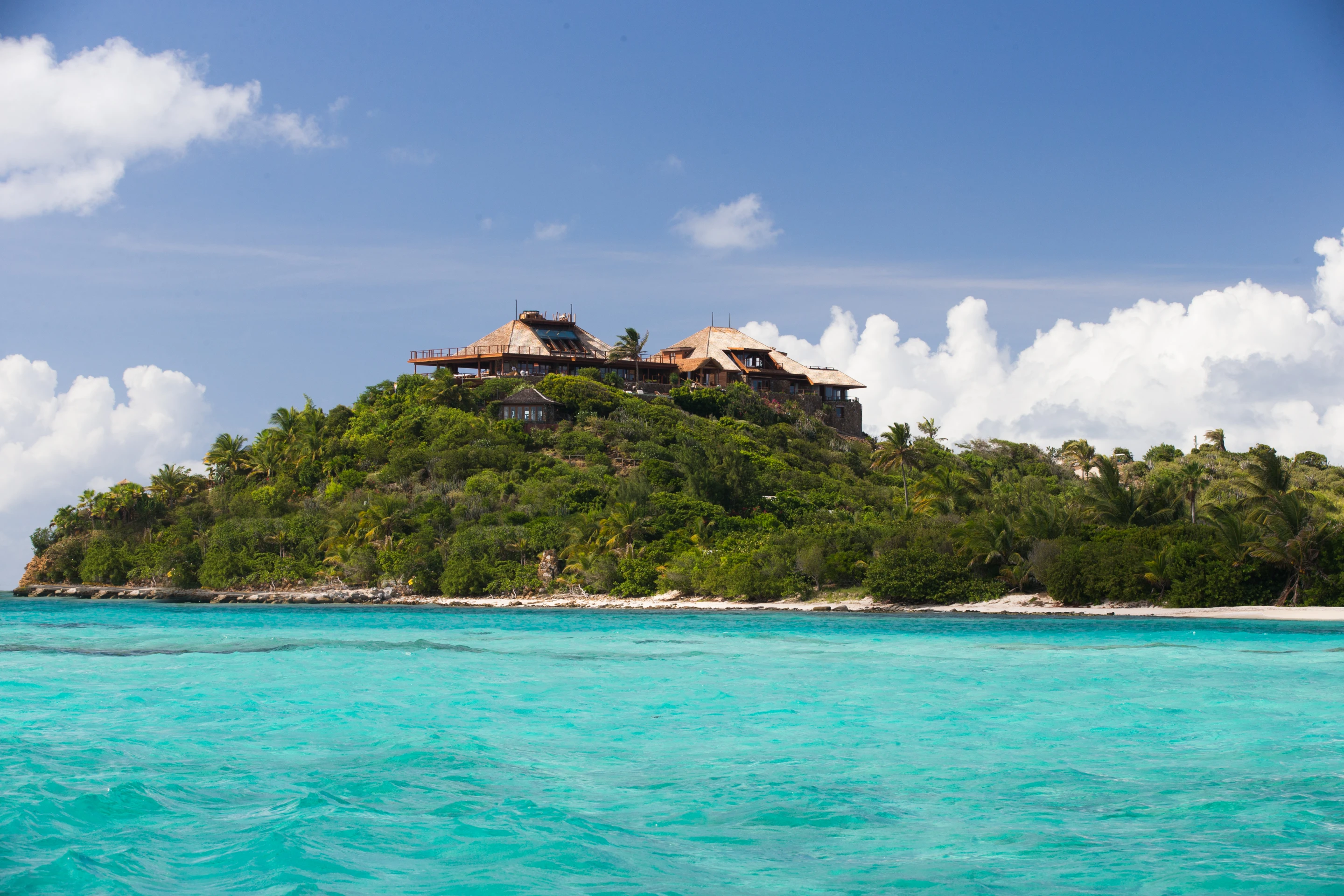 Each of the eight guest rooms has its own balcony with view of nearby Caribbean islands
