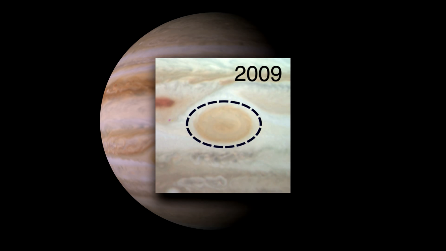 Graphic displaying the size of the GRS in 2009 relative to the size of the storm in 1995, which is shown as a black dotted line