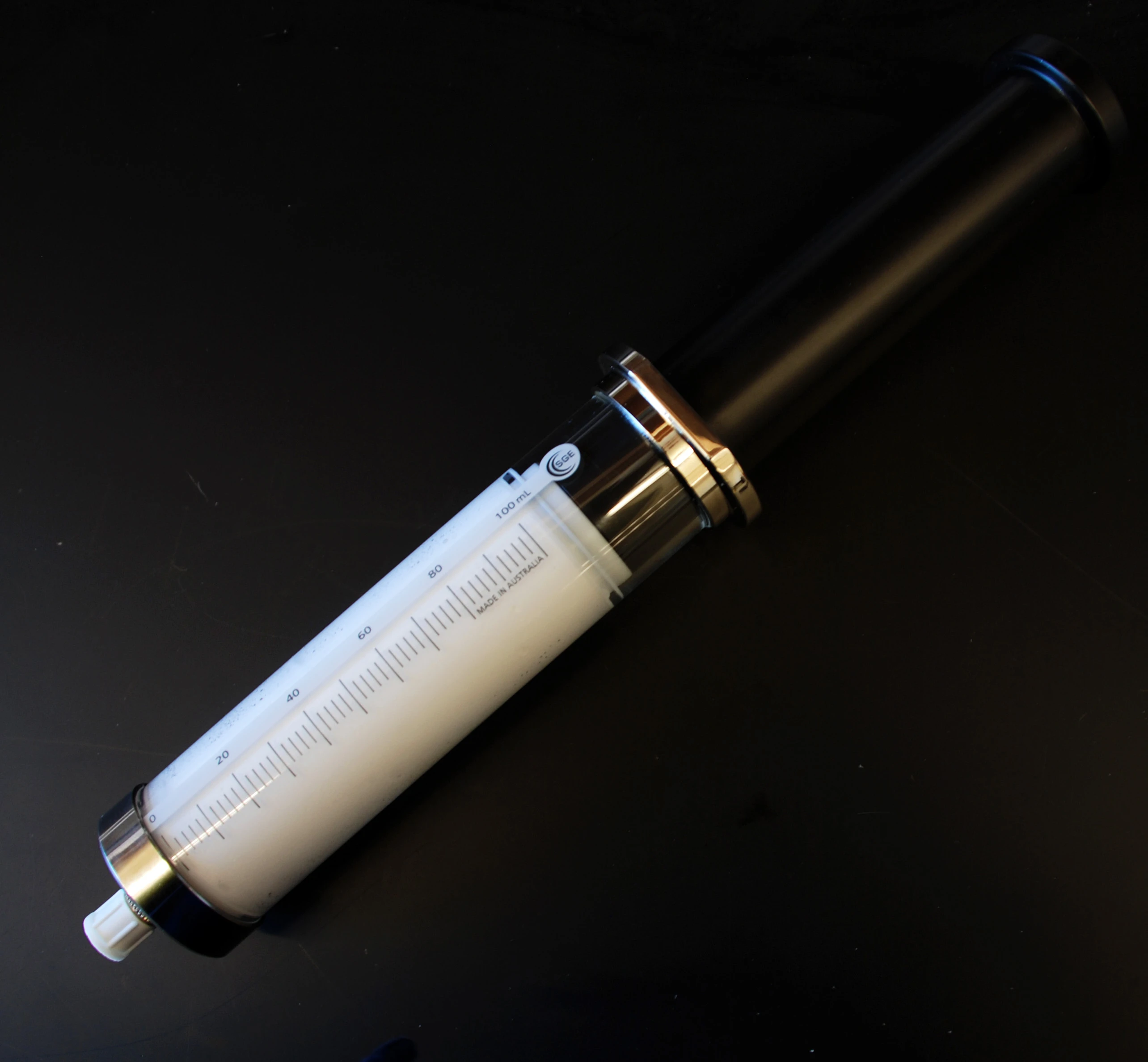 A syringe containing the oxygen microparticle solution