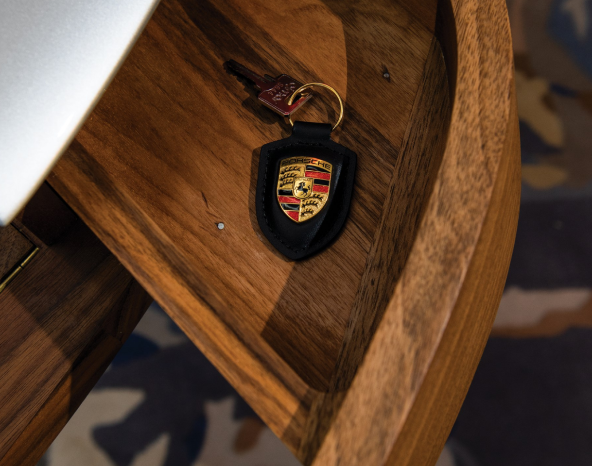 The Porsche Writing Desk features two small drawers on either side of the center writing space for extra storage
