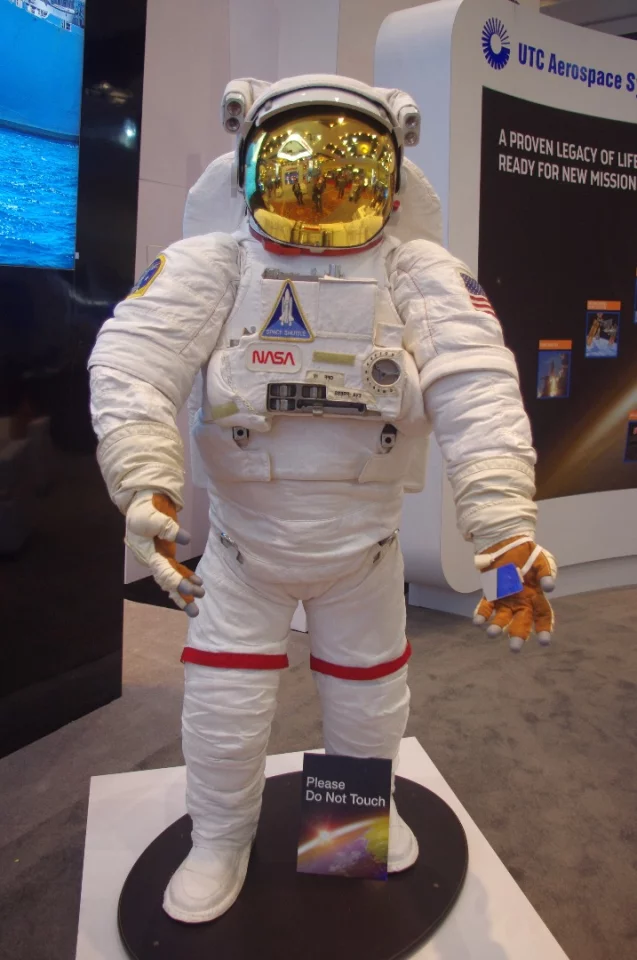 The Extravehicular Mobility Unit from UTC Aerospace Systems. "We use 18,000 parts to protect astronauts from the harsh environment of space, including a puncture-resistant outer layer to protect from micrometeroids traveling at 17,000 miles per hour," says the company. "To control temperature fluctuations ranging from -250 degrees F to +250 degrees F every 90 minutes, we provide a liquid cooling and ventilation garment under the suit that consists of 300 feet of thin tubing that circulates cooling water around the body."