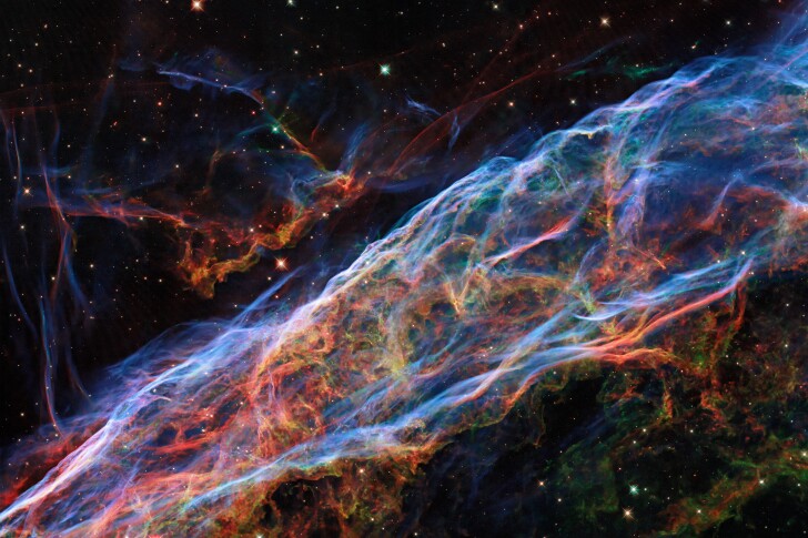 A favorite subject of astronomy photographers, the Veil nebula is the remains of a massive star that exploded as a supernova roughly 10,000 years ago. This new Hubble image uses new processing techniques to highlight finer details.