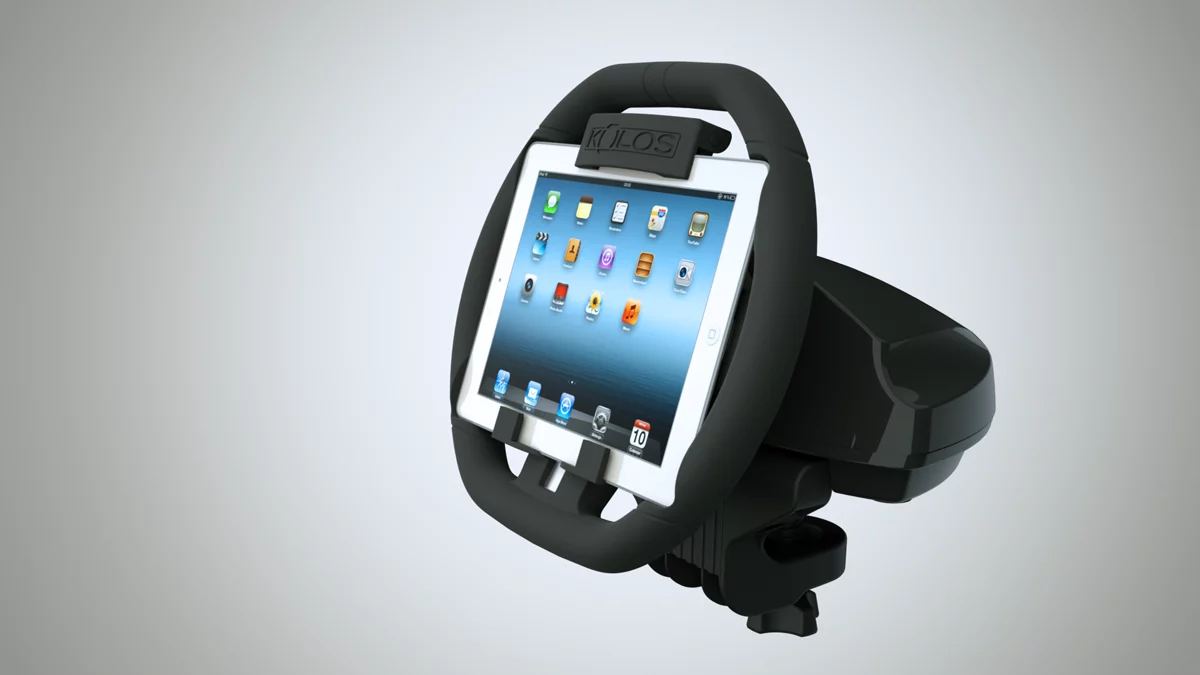 The KOLOS attaches to an iPad and turns it into a steering wheel for racing games, complete with a detachable base that attaches to most surfaces