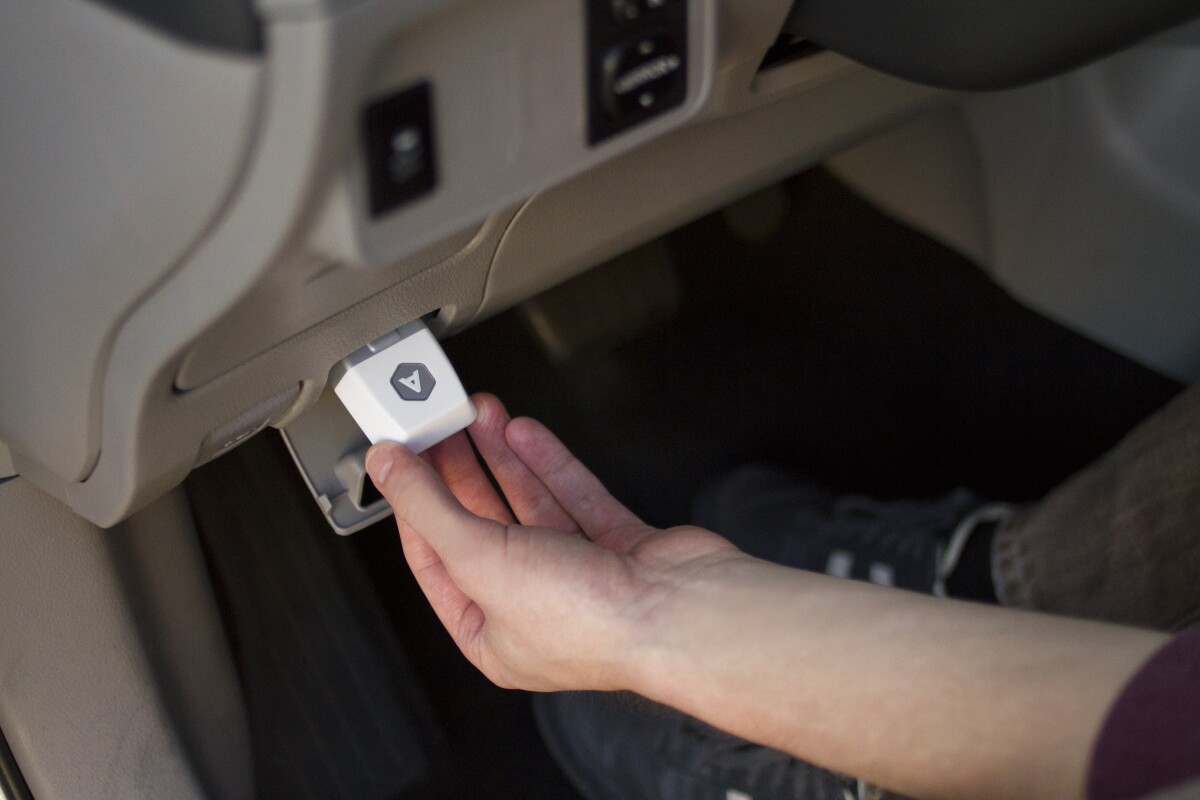 The Automatic Link plugs into your vehicle's diagnostic port, and communicates with an accompanying smartphone app