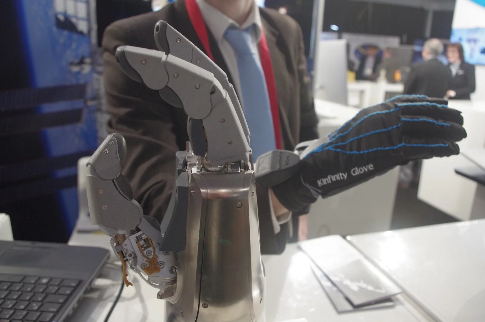 Also on exhibit at the German Aeropsace Center (GAC) booth was this robotic "Spacehand" and "Kinfinity" glove. The hand is designed to be controlled in a natural way by the wearer of the glove and can help with delicate maneuvers on spacecraft in orbit. The robotic hand and the arm to which it attaches has sensors in all the joints that provides it constant feedback on the force it is applying. GAC's Maxime Chalon said that in addition to helping astronauts on the ISS do fine inspection and repair maneuvers, the system could also help snag space debris. "If you think about catching satellites or debris that is tumbling, you can check with the manufacturer and find out how much you can press on various parts of the equipment," he told us. "You set that in the robotic system and say, 'OK, let's go there, grab it, apply as much pressure as you can, and if anything comes to close to the limit, just let go.'"