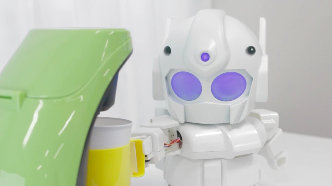 RAPIRO pushes your coffee mug into a coffee maker