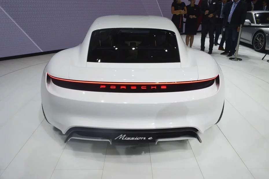 The car's broad rear end evokes the 911 without looking derivative