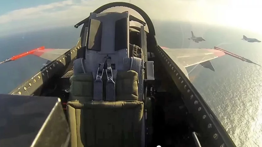 Unmanned F-16 fighter jet going through combat maneuvers in the Gulf of Mexico