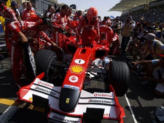 The black noses on the Ferrari cars during the weekend were a mark of respect for the ailing Pope. Schumacher climbs out of the Ferrari during a photo session - could he be the most photographed person on the planet?