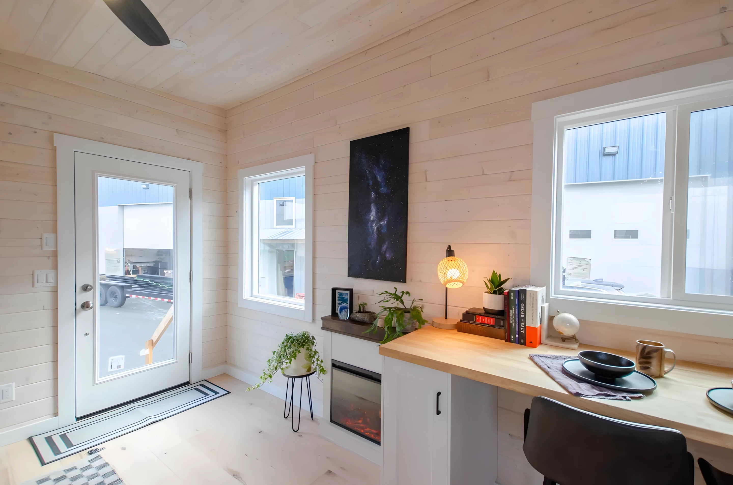 The Barred Owl's living room includes sofa and an electric fireplace that's suitable to heat the entire home