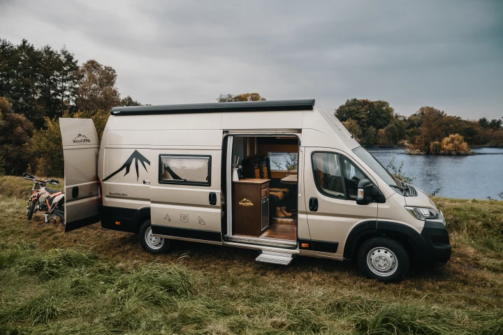 Built into a Citroën Jumper, the WoodVans Moto package combines a tiny lodge-like interior and motorcycle garage into a capable adventure camper van