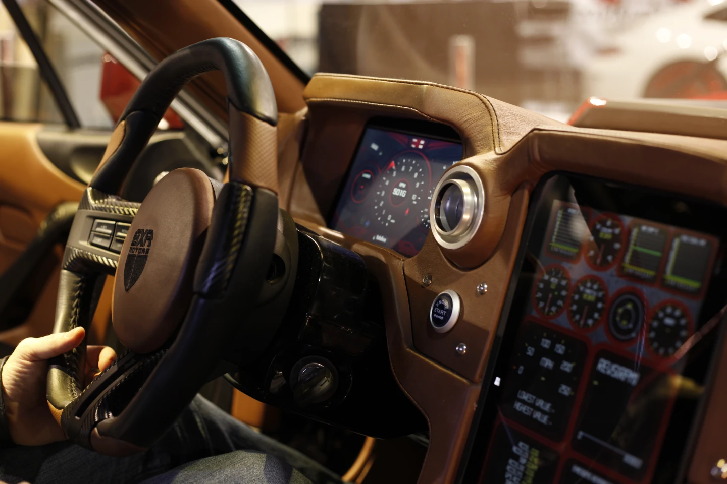 The center console is dominated by a 13-inch touchscreen display