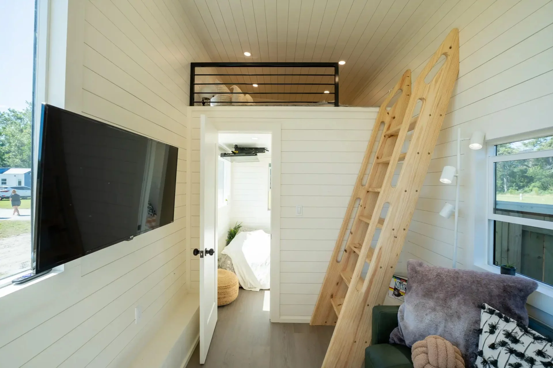 The Webster's main loft is reached by a ladder and includes a queen-sized bed