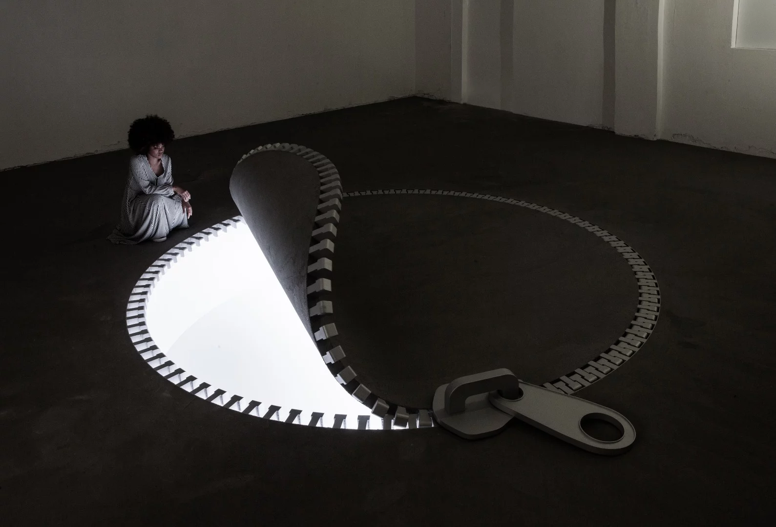 The interior of IQOS World includes a zip installation on the floor