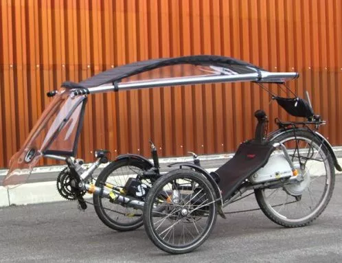 The Veltop is a removable windscreen/canopy/side window system, for protecting cyclists from rain and cold winds