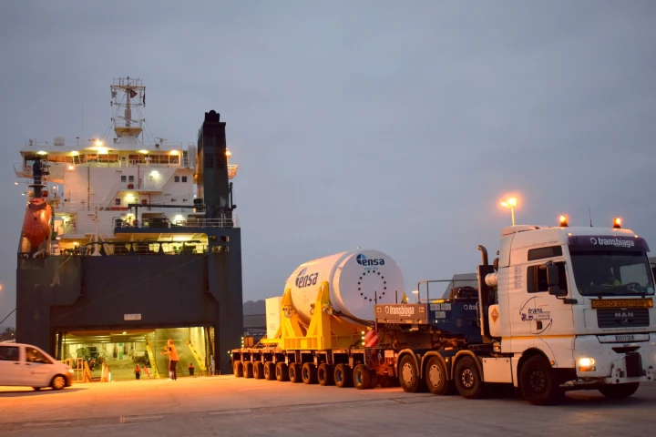 Loading the nuclear waste transportation and storage cask onto a barge for the second leg of Sandia National Laboratories’ triathlon