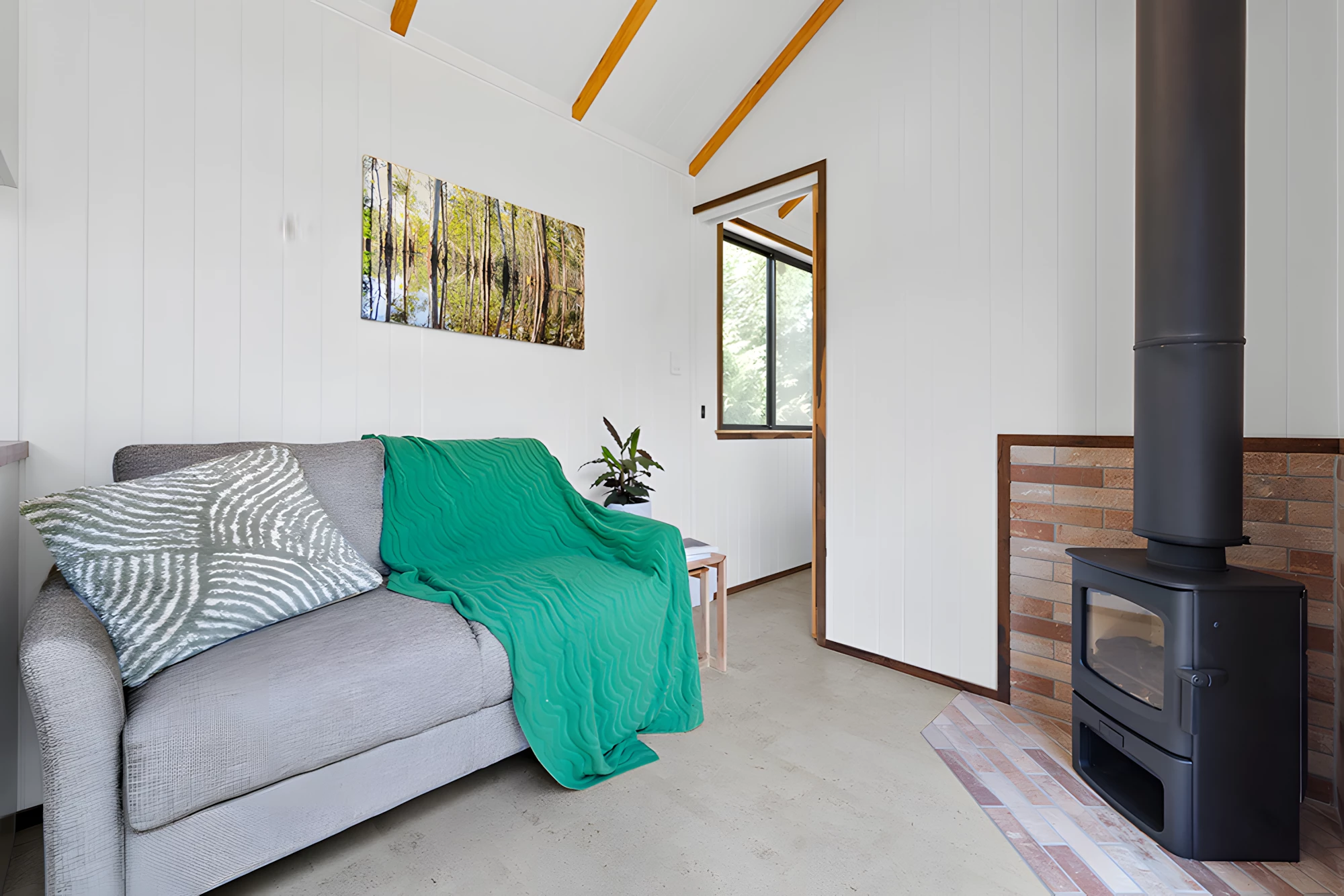 The Casuarina's living room includes a sofa bed for guests
