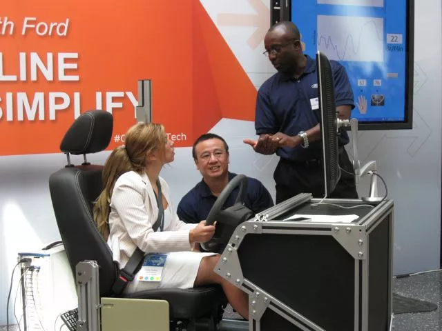 A conference participant tries out the test rig (Photo: Gizmag)