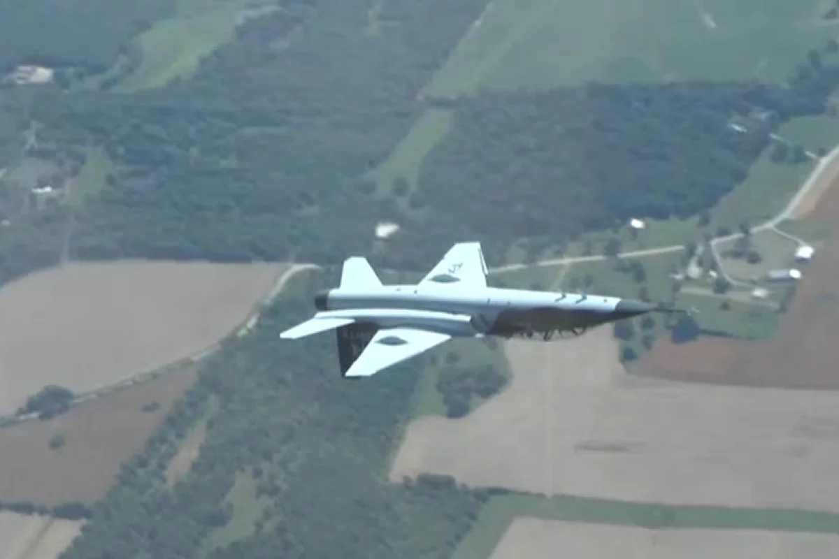 A Boeing T-7A Red Hawk Trainer flying inverted