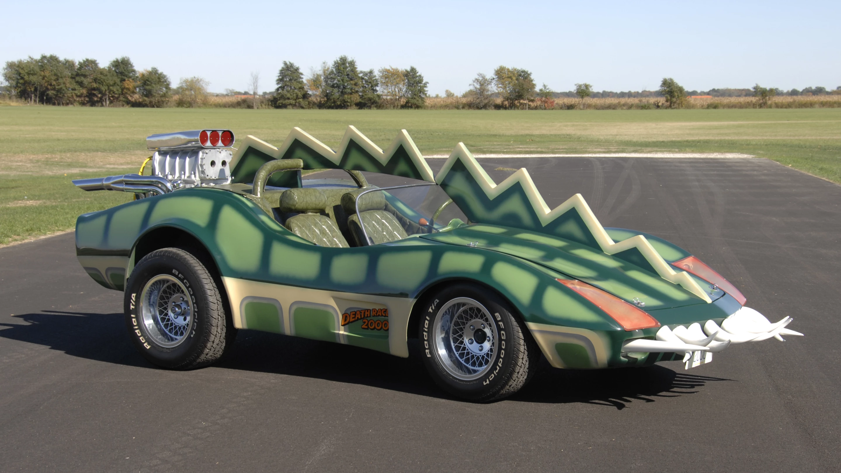 The car that is coming to auction is the Alligator Corvette driven by Carradine in Death Race 2000 (1975). The one-of-a-kind “alligator” Corvette (it's actually a Volkswagen chassis with an air-cooled Corvair motor), is expected to fetch between $20,000 and $25,000, despite the fact it got lots of screen time as Carradine (Frankenstein) fights against his deadly rival Stallone (Machine Gun Joe).