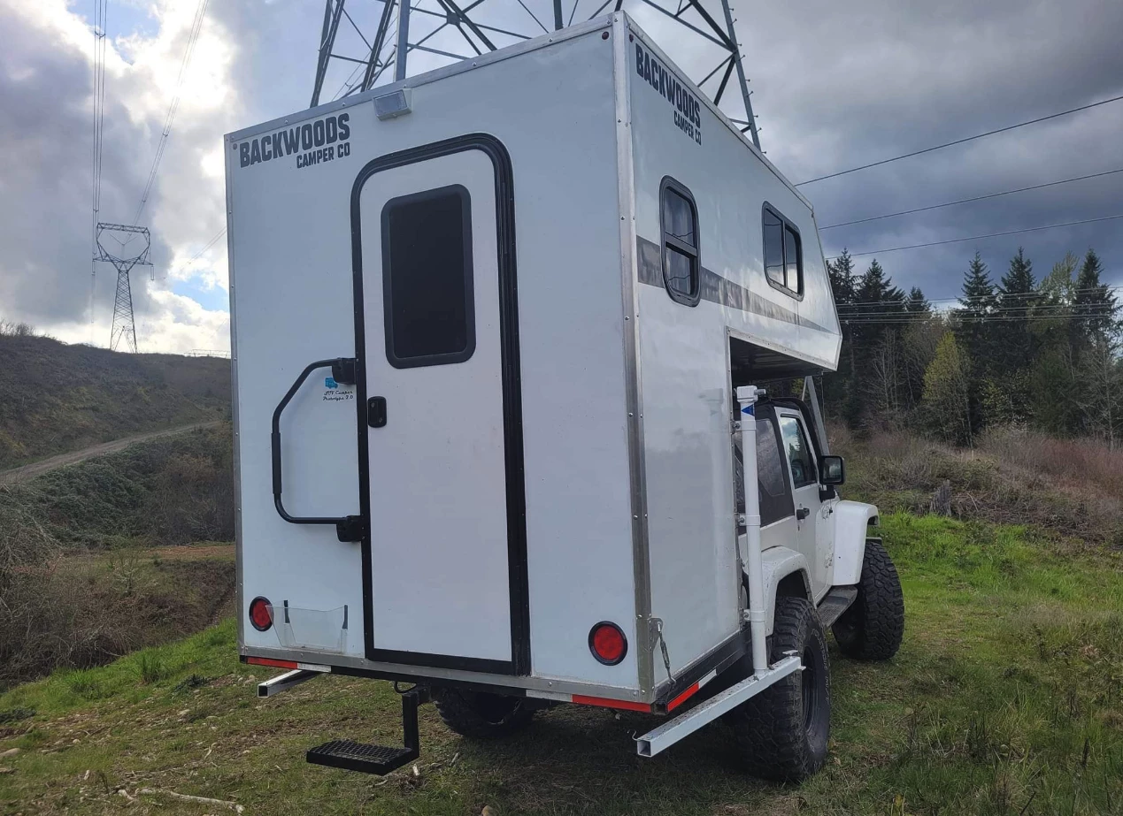 Measuring 7 feet from its lowest point to roof, the Backwoods offers a high door and standing height entry room that it can split into a kitchen and wet bath cell
