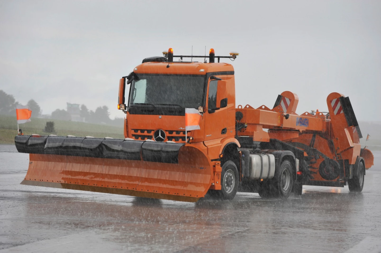 The control units in each truck can individually deploy various accessories for the snow plowing operations, including side plows, scoops, brushes, and so forth